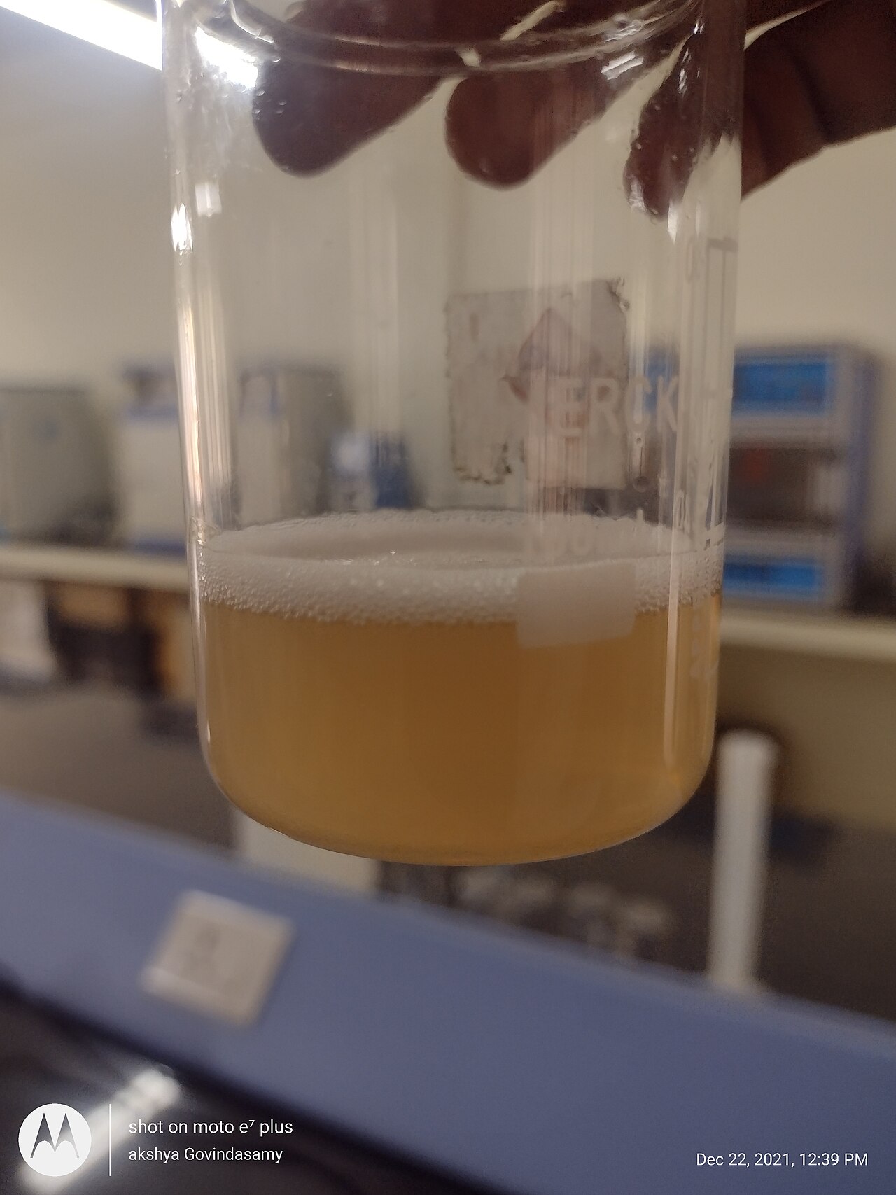 A beaker holding a solution