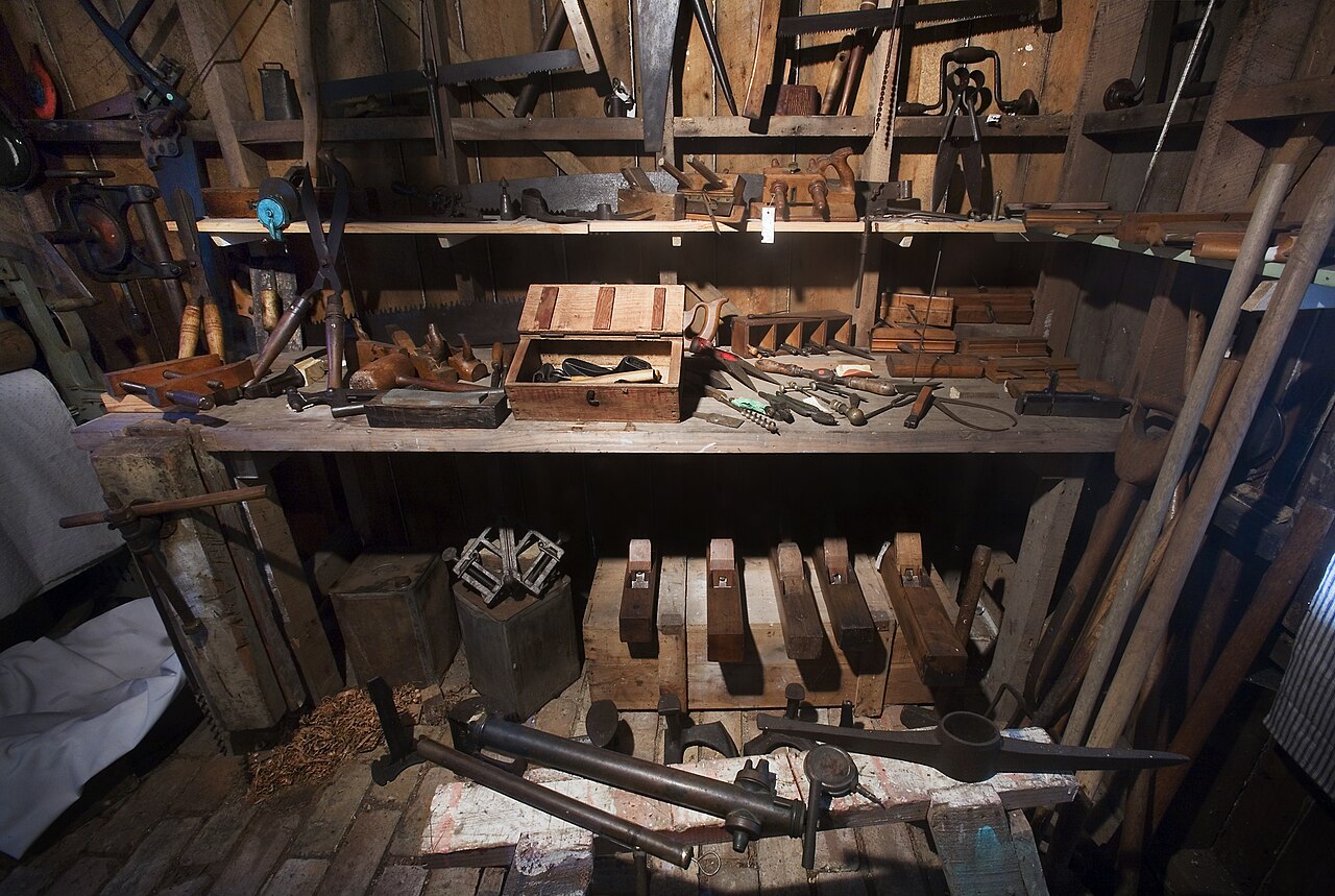 A workbench covered with hand tools